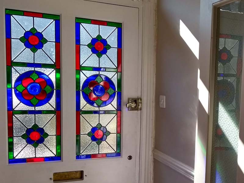 pair of stained glass from door panels fitted in a new door in Street, Somerset